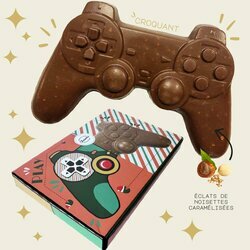 Manette de jeu de No�l en chocolat lait contenant des grains de noisettes caram�lis�es